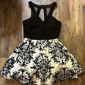 Gorgeous boutique cocktail dress black and white size 7. Worn once.